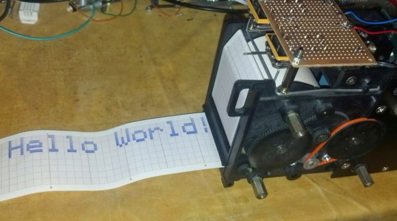 A chart recorder printing 'Hello World'
