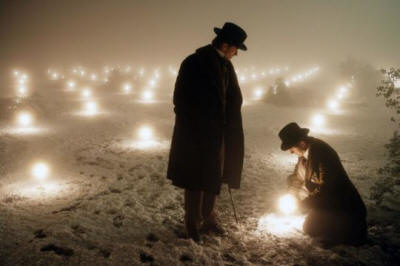 men standing in field of light bulbs