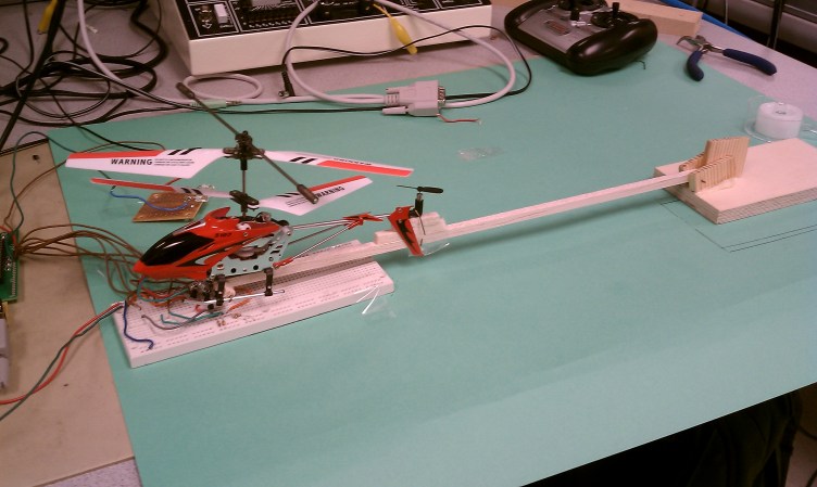model helicopter attached to boom