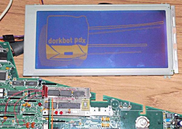 Dorkbot logo on a large LCD display