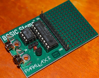 The Basic Stamp 1. A Simple circuit with just a microcontroller, an EEPROM, crystal, and brownout circuit.