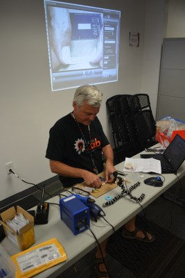 [Bob] demonstrating the scotch-tape trick under USB microscope