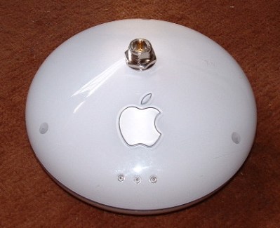 An Apple Airport router with an N connector grafted into it. (Mike Harris: Adapting the Apple Airport for external long-range wireless antennas)