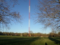 A guyed mast in the suburbs.