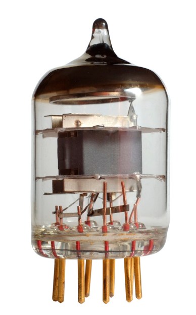 The getter of a vacuum tube (the silvery top) reacts with gasses produced by the tube elements during operation.