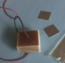 Resin and wax covered capacitor