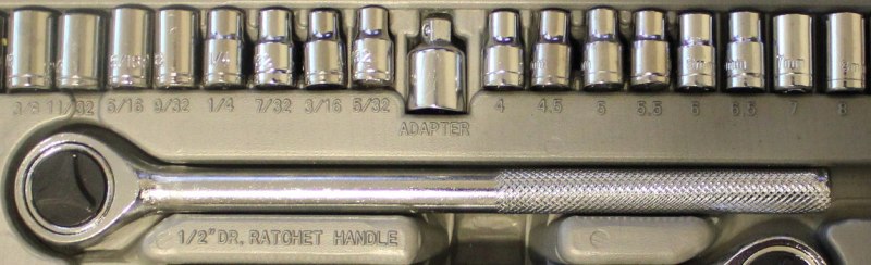 A socket wrench set in Imperial fractions on the left and metric on the right. 