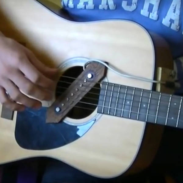 Rocking An Acoustic Guitar By Making It