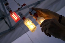 [Hugh Pryor]'s EL wire and bottle light bulbs. Image courtesy of [Jasmine]