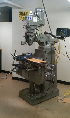 This is a vertical milling machine, with a head that rotates, tilts, and swivels (photo courtesy of Wikipedia)