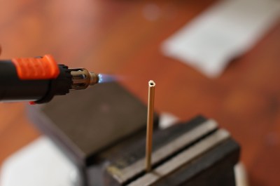 A pencil torch and vise come together for a brazing operation.