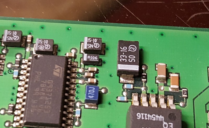 Vias at regular intervals around the outside of the board (and some in random places within the board) are called via stitching.