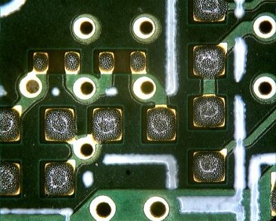 Solder paste on a PCB, probably depositied by machineas it's much tidier than our stencil work. Ossewa [CC BY-SA 3.0], via Wikimedia Commons.
