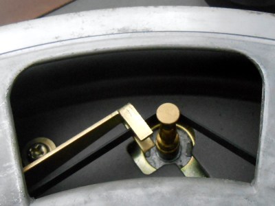 The belt-drive mechanism in close-up. The lever on the left changes speed by shifting the belt between different widths of the motor spindle.