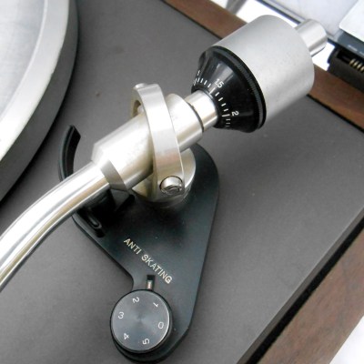 The tonearm fulcrum, showing typical tracking weight and anti-skate adjustments.