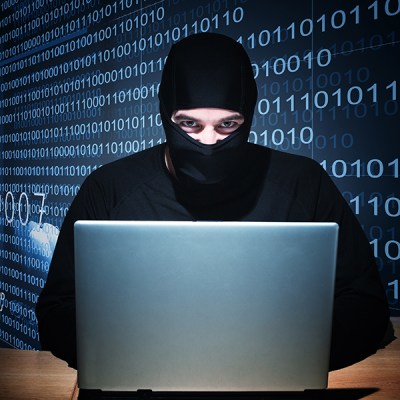 A hacker sporting a one-hole balaclava, STEALING YOUR DATA