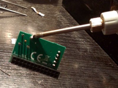 Yes, that's a powered-up soldering iron soldered fast to a component.