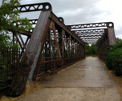 A handsome riveted railway bridge, over the River Avon near Stratford-upon-Avon, UK.