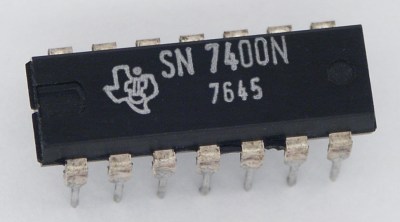 The daddy of all TTL logic gates, the Texas Instruments 7400 quad NAND gate. Stefan506 [CC-BY-SA-3.0].