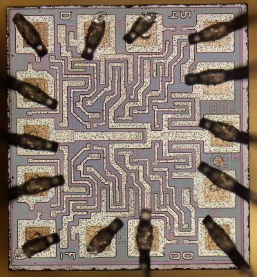 The die of a decapped National Semiconductor-branded 5400 from the 1980s Robert.Baruch [CC BY-SA 4.0]