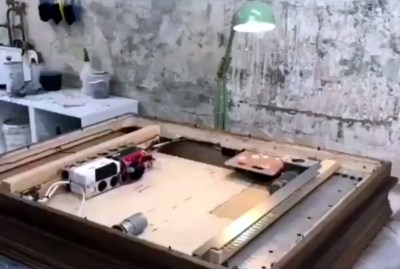 The interior of the Banksy shredder frame, taken from a frame of the video.