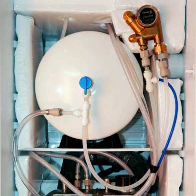 inside shot of a refrigerator with water bulk tank and seltzer pump