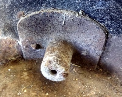 A cast-iron tuyere, part of a small portable hearth. This would normally be surrounded by firebrick.