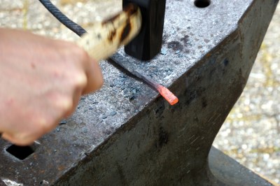 Forming the "slug" of metal that will become the head of the nail. Photo: © Martina Short, used here with permission..