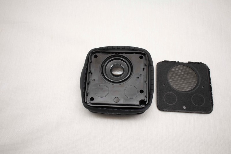 Pry off speaker grille.