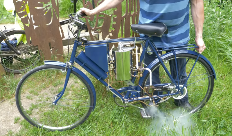 Traveling by water and wood on a steam-powered tricycle