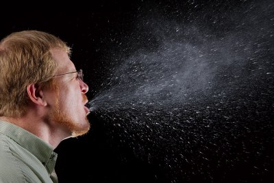 It's rather sickening to look at the quantity of droplets expelled by a sneeze. James Gathany / Public domain