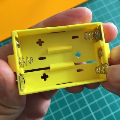3d printed battery holder, showing inserted spring contacts