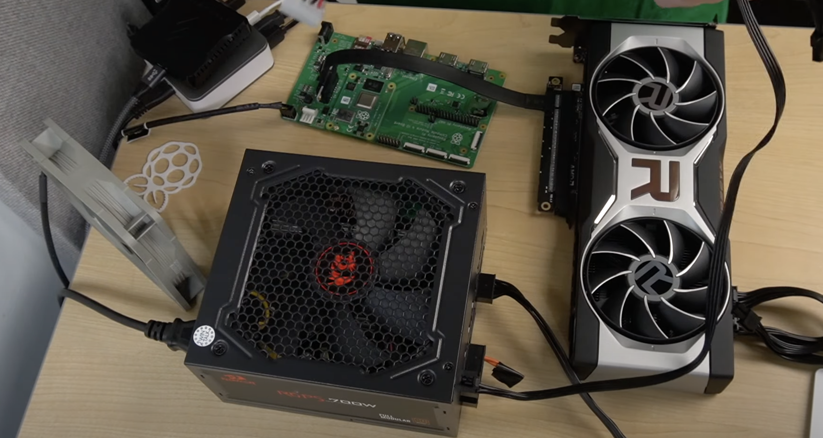 An AMD GPU plugged into an ATX PSU and Raspberry PI CM4