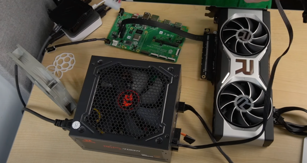 An AMD GPU plugged into an ATX PSU and Raspberry PI CM4