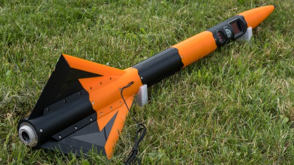 3D printed rocket laying on grass