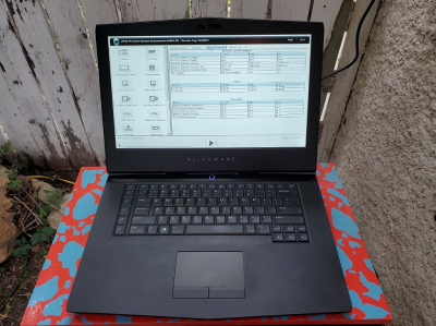 An open laptop showing a diagnostic tool on the screen