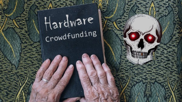 Two hands on a book labeled "hardware crowdfunding"
