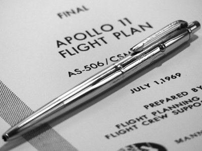 An original Fisher Space Pen AG-7 atop the Apollo 11 flight plan.