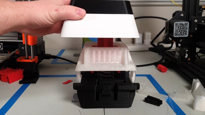 A giant, 3D-printed key switch that sends F to pay respects.