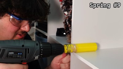 Making a custom spring using a drill and a 3D printed dowel.