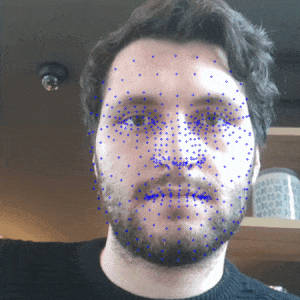 Animated face with small blue dots as 3D feature markers.
