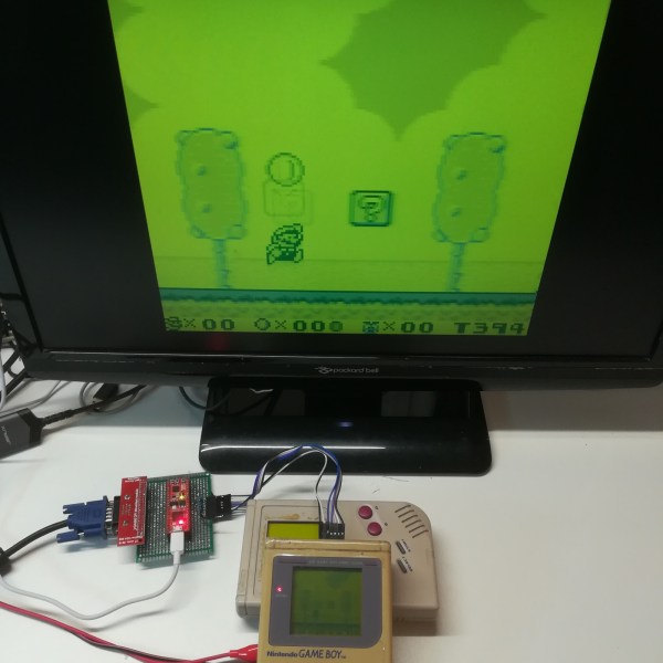 A Game Boy connected to a monitor while playing Super Mario Land 2