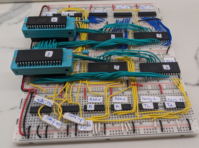 A breadboard filled with logic chips and wiring