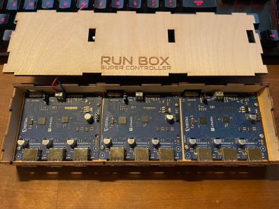 A USB hub in a laser-cut wooden enclosure