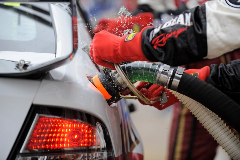 Refueling hose inserted into car