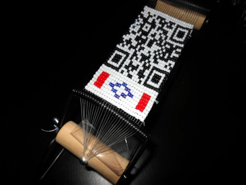 This beaded QR code tells a story when scanned.