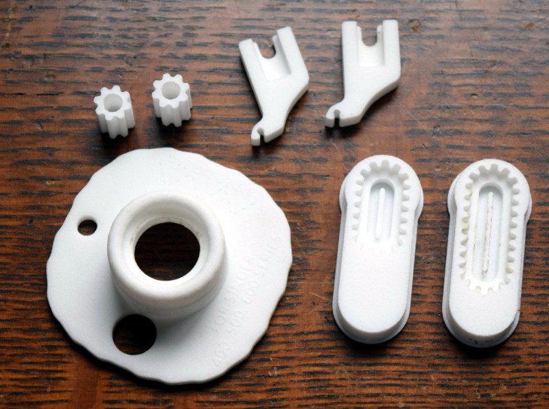 An array of 3D-printed parts for old sewing machines.
