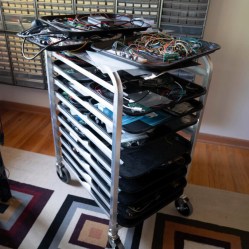 A rack of trays, each with a project