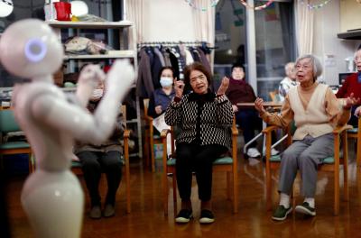 A robot leads seniors in an exercise routine.