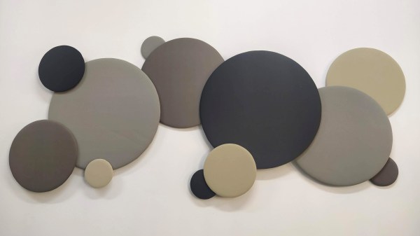 Ray's panels on the wall - circles of different sizes (from 60 to 15cm in diameter) covered by fabric of different shades, their arrangement vaguely resembling a cloud.